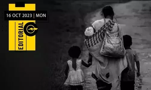 a poor lady walking with two kids