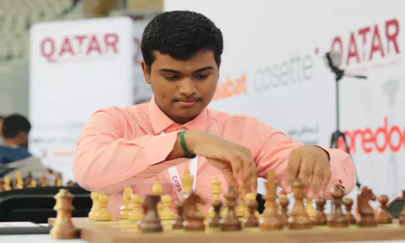 M Pranesh competing against Carlson in Qatar Masters Chess