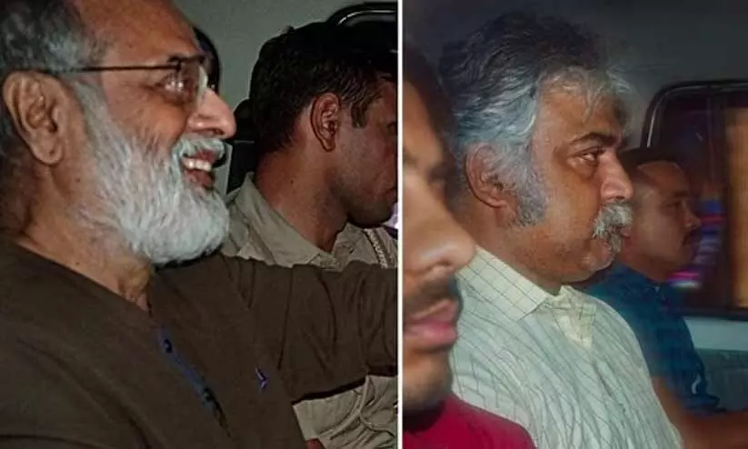 news click editor Prabir Purkayastha and HR head Amit Chakravarty