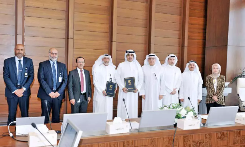 Kuwait University and KOC authorities with charter