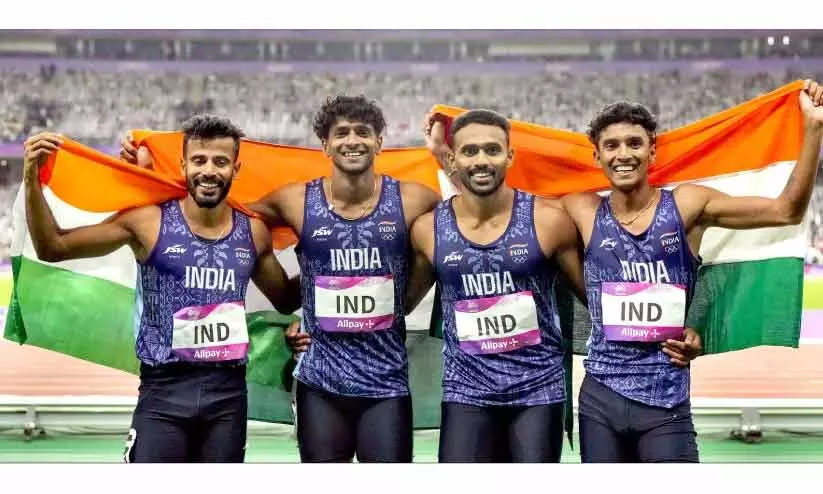 റിലേയിൽ സ്വർണം നേടിയ ഇന്ത്യൻ ടീം റിലേയിൽ സ്വർണം നേടിയ ഇന്ത്യൻ ടീം