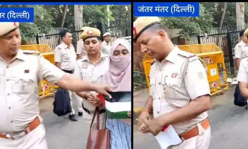 policemen tear palastine flag amid protest