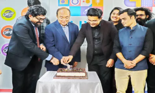 Olive Suno Radio Network 6th Anniversary Announcements Management Member Krishna Kumar, Satish G. Pillai and Aamir Ali start by cutting the cake.