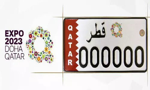 Model of vehicle number plate with Expo logo