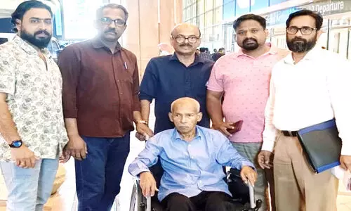 Balachandran Pillai with Keli workers at Riyadh Airport