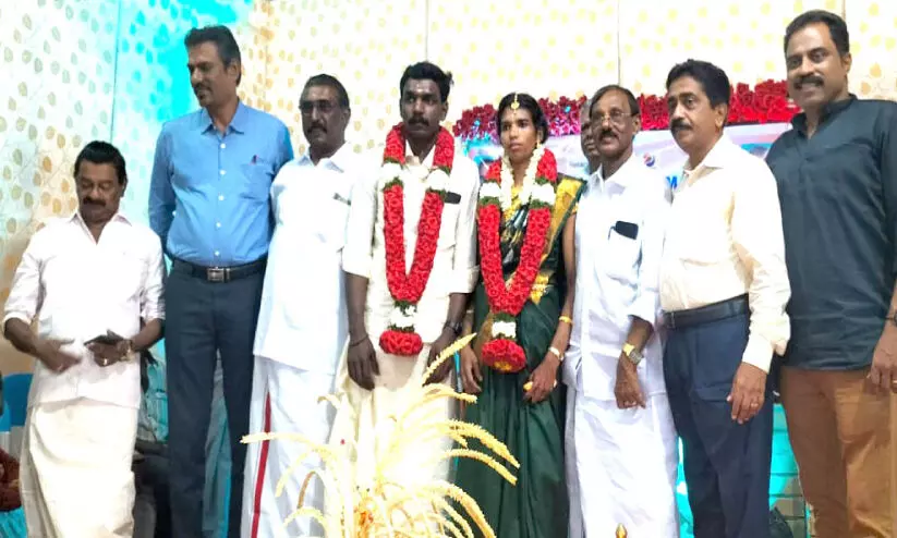 Rotary Club officers with married Mathu and Arun