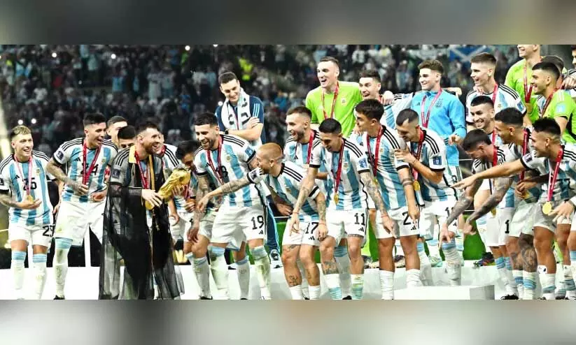 ഫു​ട്ബാ​ൾ ലോ​ക​ക​പ്പ് നേ​ടി​യ അ​ർ​ജ​ന്റീ​ന ടീം ​ട്രോ​ഫി​യു​മാ​യി (ഫയൽ)