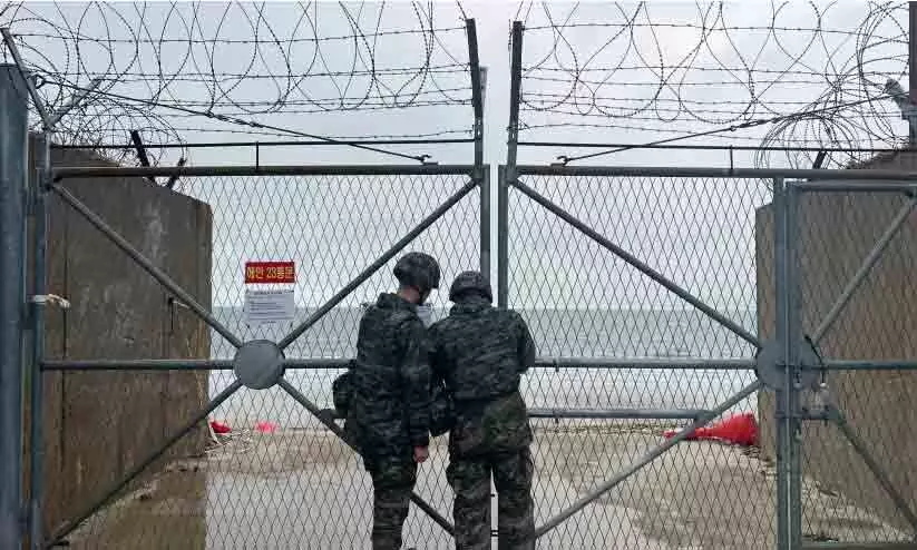 South Korean marines close a gate on Yeonpyeong Island, South Korea, Saturday, Jan. 6, 2024.