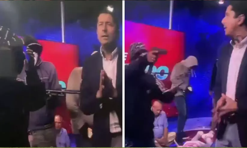 തത്സമയ സംപ്രേഷണത്തിനിടെ ചാനൽ സ്റ്റുഡിയോയിലേക്ക് അതിക്രമിച്ചുകയറി തോക്കുധാരികൾ -ദൃശ്യങ്ങൾ വൈറൽ തത്സമയ സംപ്രേഷണത്തിനിടെ ചാനൽ സ്റ്റുഡിയോയിലേക്ക് അതിക്രമിച്ചുകയറി തോക്കുധാരികൾ -ദൃശ്യങ്ങൾ വൈറൽ