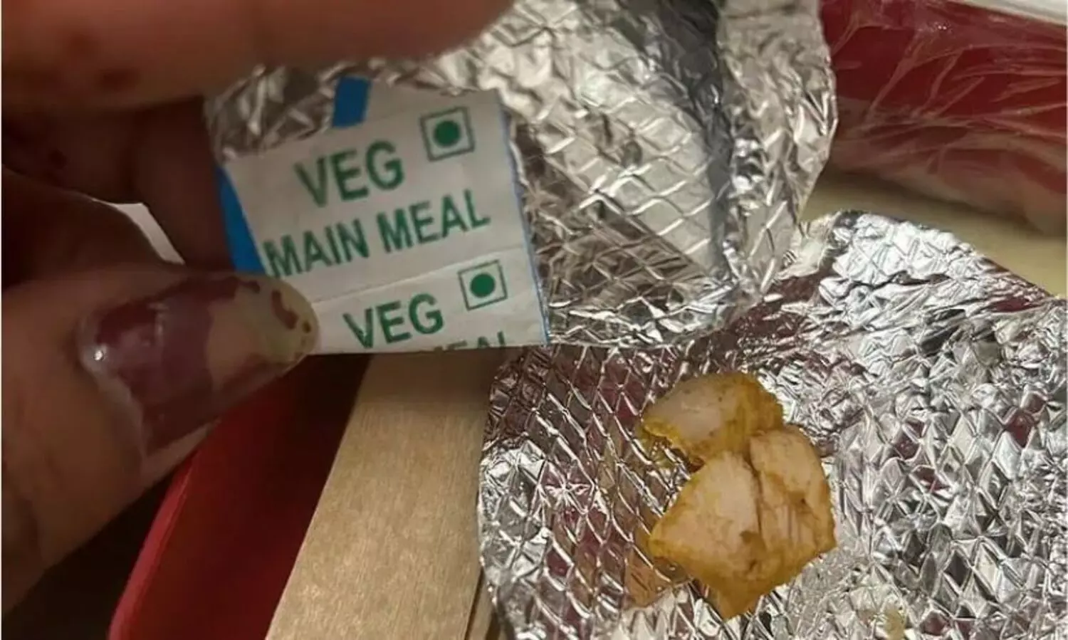 Veg meal served with chicken pieces in Air India