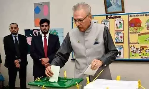 Pakistan President Arif Alvi reacts to election results
