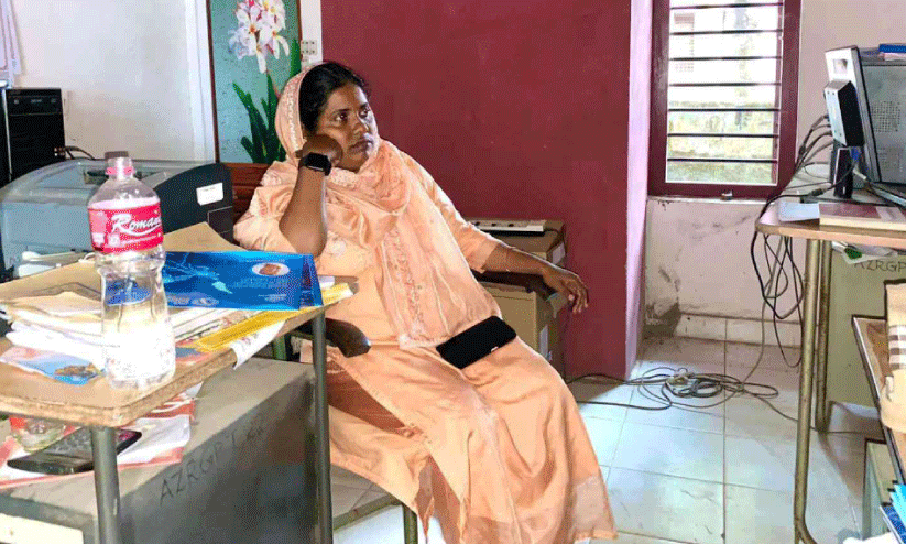 female panchayat member sat in office