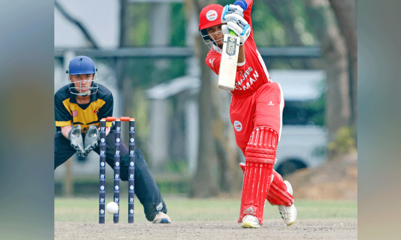 Oman cricketer batting