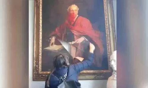 destroy historic painting of Lord Balfour at Cambridge University