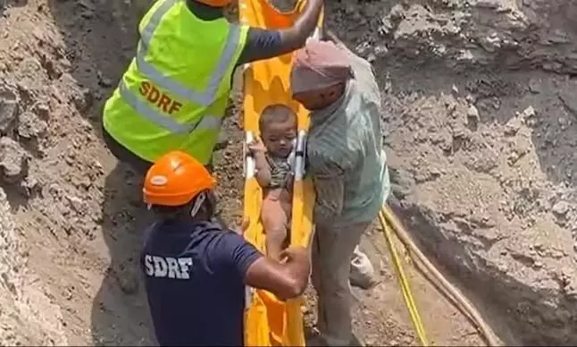 A two-year-old boy was rescued after falling into a borehole while playing in the backyard