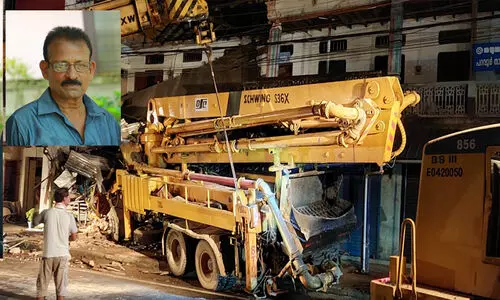 An out-of-control mobile piling truck rammed into a shopping complex; The newspaper delivery man died