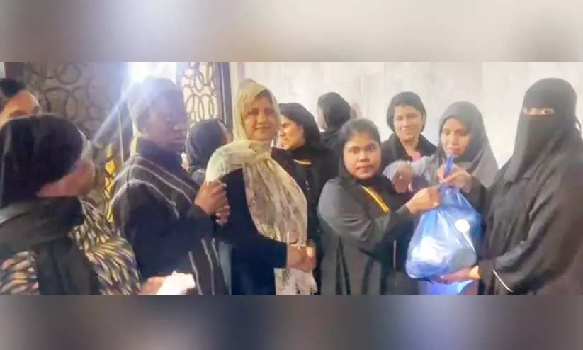 distributing eid kits for the family of labour camp employees