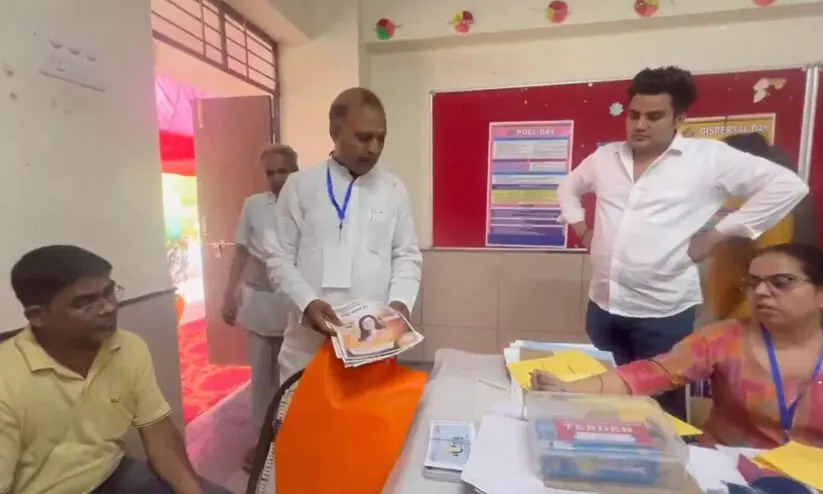 BJP posters seized by Somnath Bharti from polling booth in New Delhi BJP posters seized by Somnath Bharti from polling booth in New Delhi