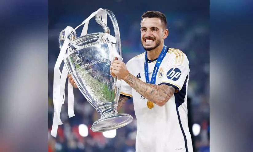 Real Madrid Player Joselu with champions league trophy Real Madrid Player Joselu with champions league trophy