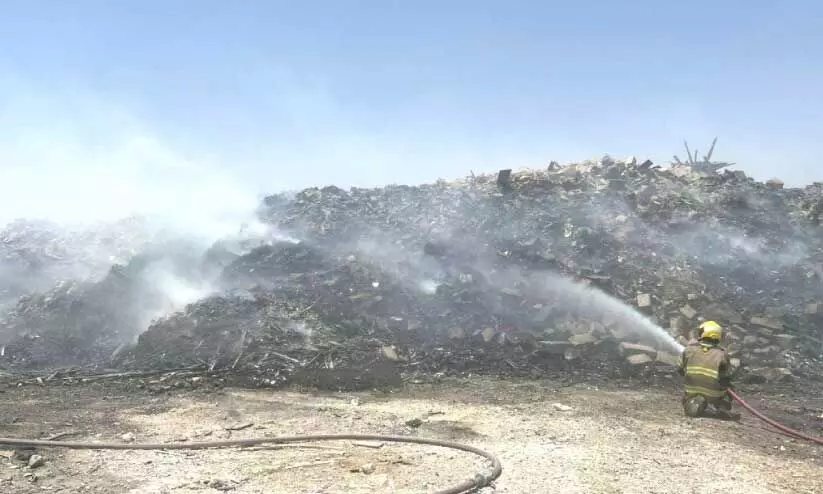Dousing the fire at the garbage dump on Salmi Road