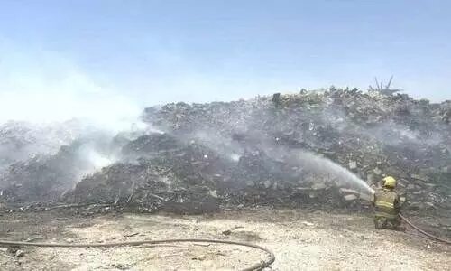 Dousing the fire at the garbage dump on Salmi Road