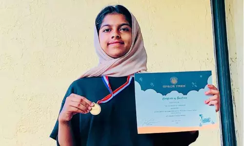 Hani With medal and certificate