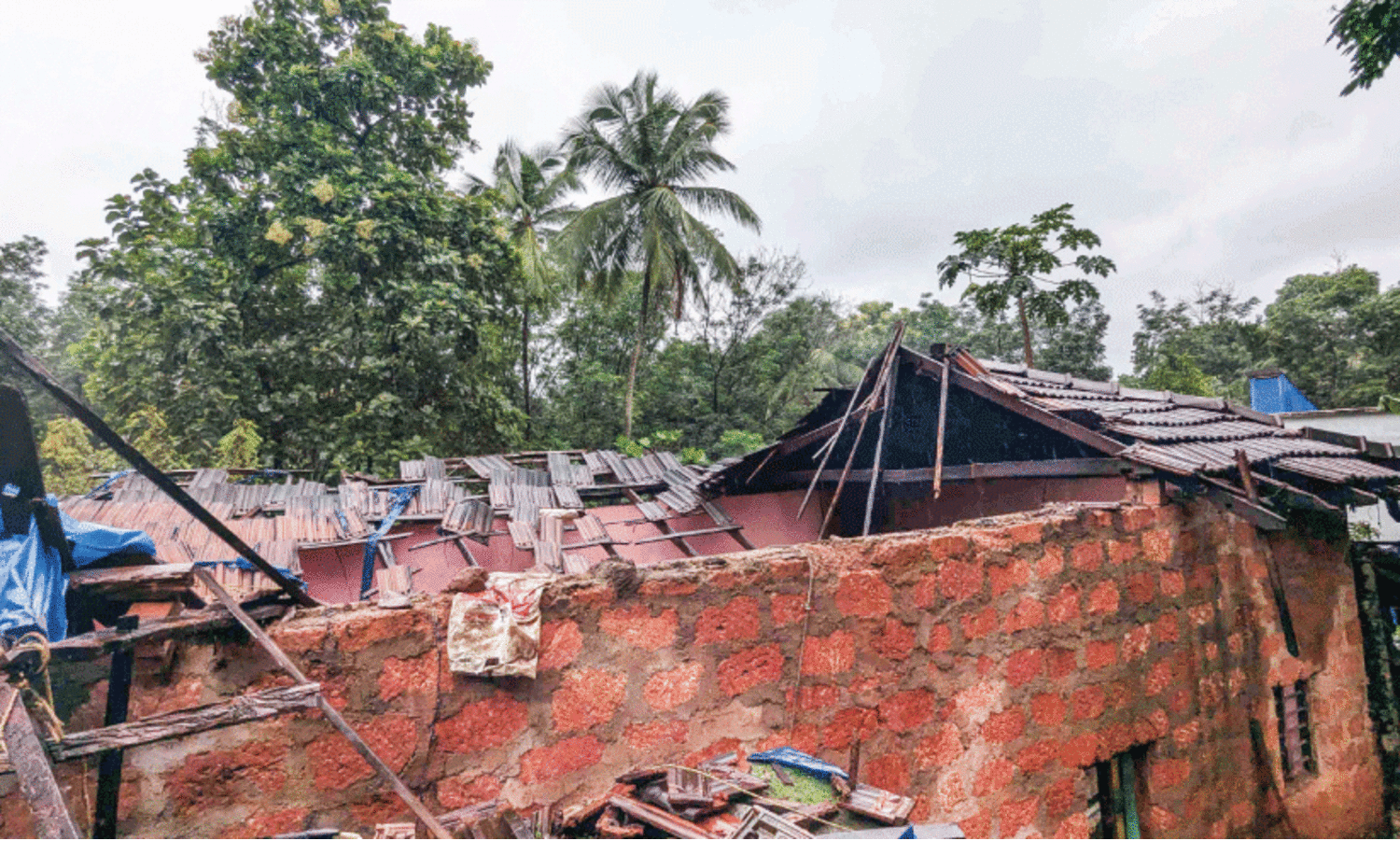 House demolished in heavy rain