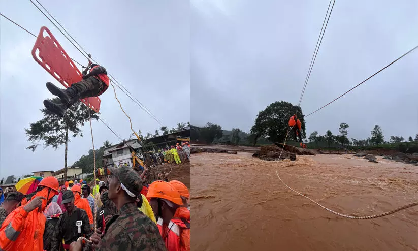 രക്ഷിക്കാൻ നാവികസേനയുടെ 50 റിവർ ക്രോസിങ് ടീം; വടംകെട്ടി ആളുകളെ പുറത്തെത്തിക്കുന്നു