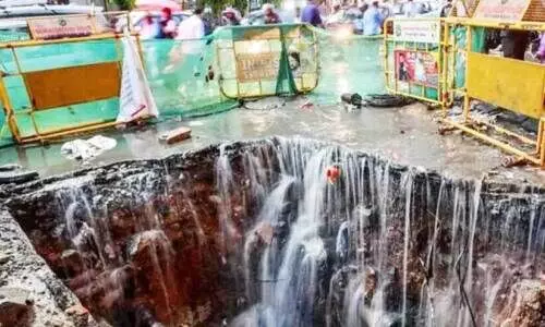 Road damaged due to flooding in Bangalore city