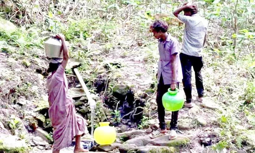 tribals collecting water