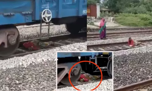 രക്ഷപ്പെടാൻ മറ്റുമാർഗങ്ങളില്ല, റെയിൽ പാളത്തിൽ അനങ്ങാതെ കിടന്നു; ജീവൻ തിരിച്ചുപിടിച്ച യുവതിയുടെ ദൃശ്യം വൈറൽ -വിഡിയോ