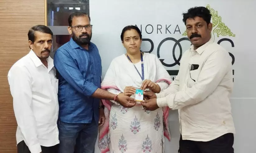 Handed over norka insurance cards Handed over norka insurance cards