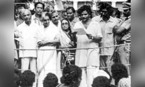 Yechury reading the resolution in the presence of  Indira Gandhi