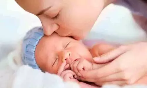 kissing newborn