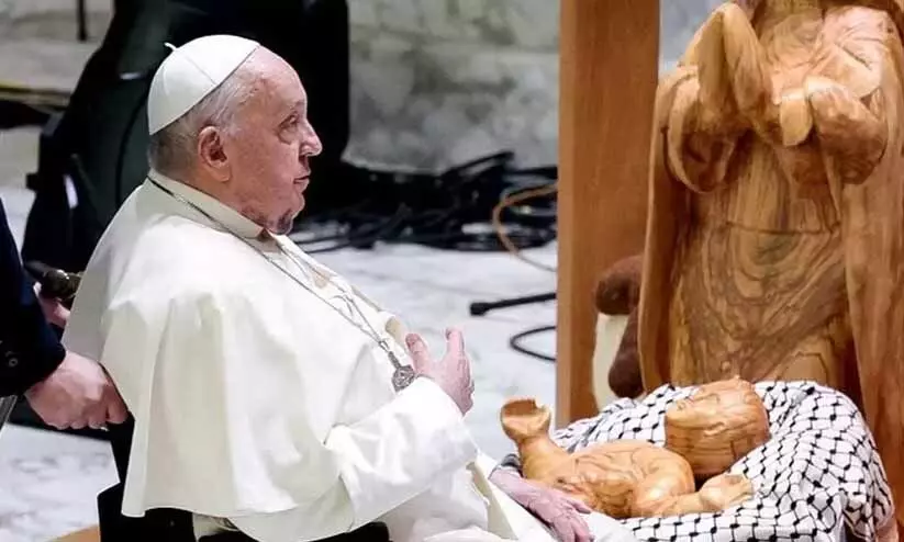 Pope unveils nativity scene with baby Jesus wrapped in Palestinian keffiyeh Pope unveils nativity scene with baby Jesus wrapped in Palestinian keffiyeh
