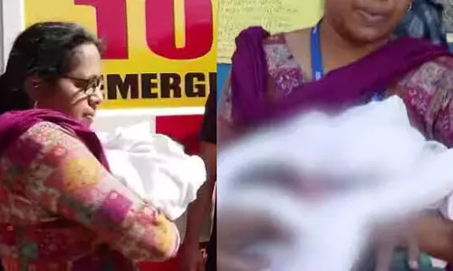 A tribal woman gives birth in a jeep