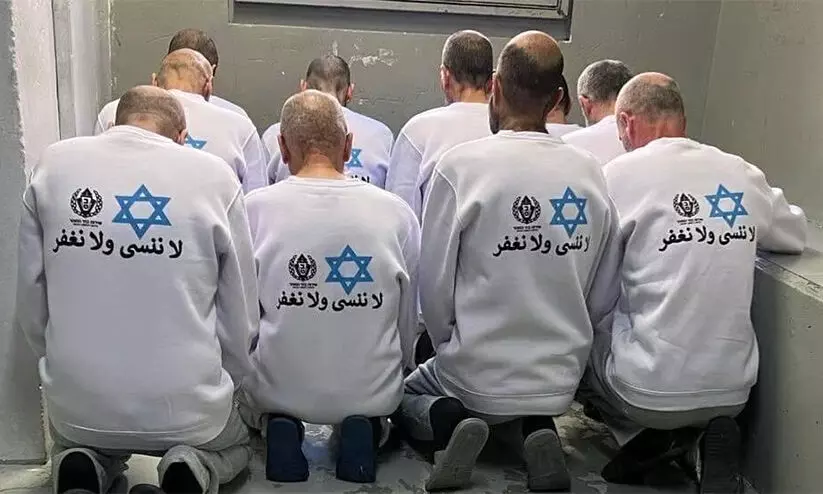 Freed Palestinian prisoners wear Star of David shirts Freed Palestinian prisoners wear Star of David shirts