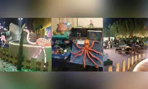 യാം​ബു പു​ഷ്പ​മേ​ള​യി​ൽ കൗ​തു​കം പ​ക​ർ​ന്ന്​ റീ​സൈ​ക്കി​ൾ ഗാ​ർ​ഡ​ൻ