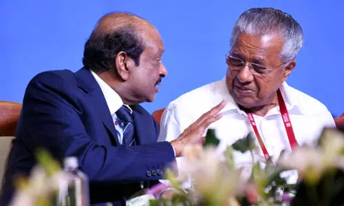 M. A. Yusuff Ali,Pinarayi  Vijayan