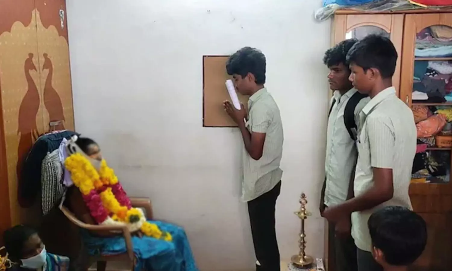 Tamil Nadu Class 12 falls at dead mothers feet for blessings before exam