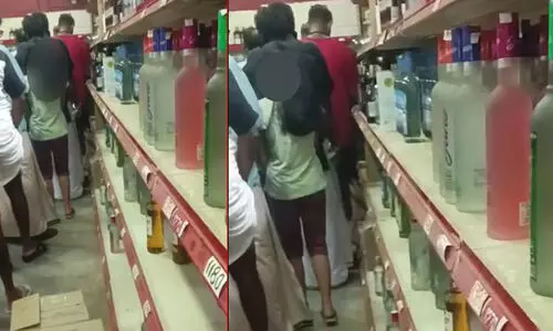 മദ്യ ശാലയിലെ വരിയിൽ പെണ്‍കുട്ടി; പിതാവിനെതിരെ കേസില്ല