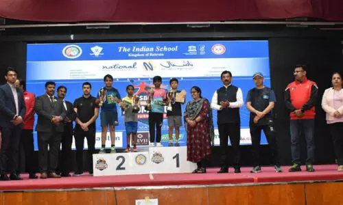 giving medals to badminton winners