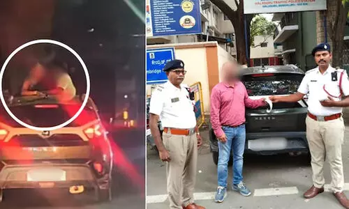 കാറിന്റെ സൺറൂഫ് തുറന്നിട്ട് ചുംബനം; 1500 രൂപ പിഴയിട്ട് പൊലീസ്