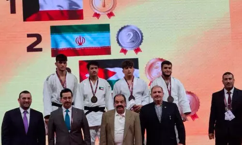 Kuwaiti judo team members in the victory stand