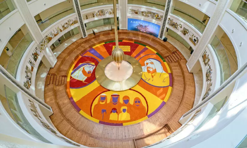 Health workers create a huge pookalam Health workers create a huge pookalam