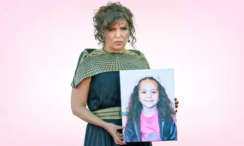 Kahoutar Ben Haniya with a picture of Hind Rajab