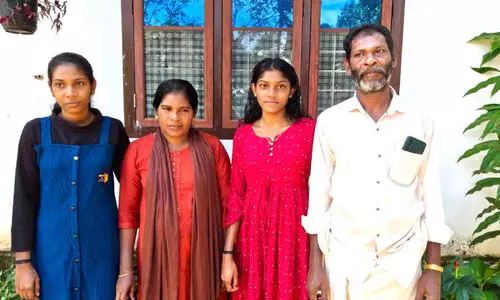 With his loving mother Bindu, sister Laya, and father Mohan