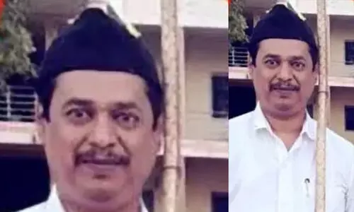 ആർ.എസ്.എസ് പ്രകടനത്തിൽ അണിനിരന്ന ഉദ്യോഗസ്ഥനെ സസ്പെൻഡ് ചെയ്യണമെന്ന്