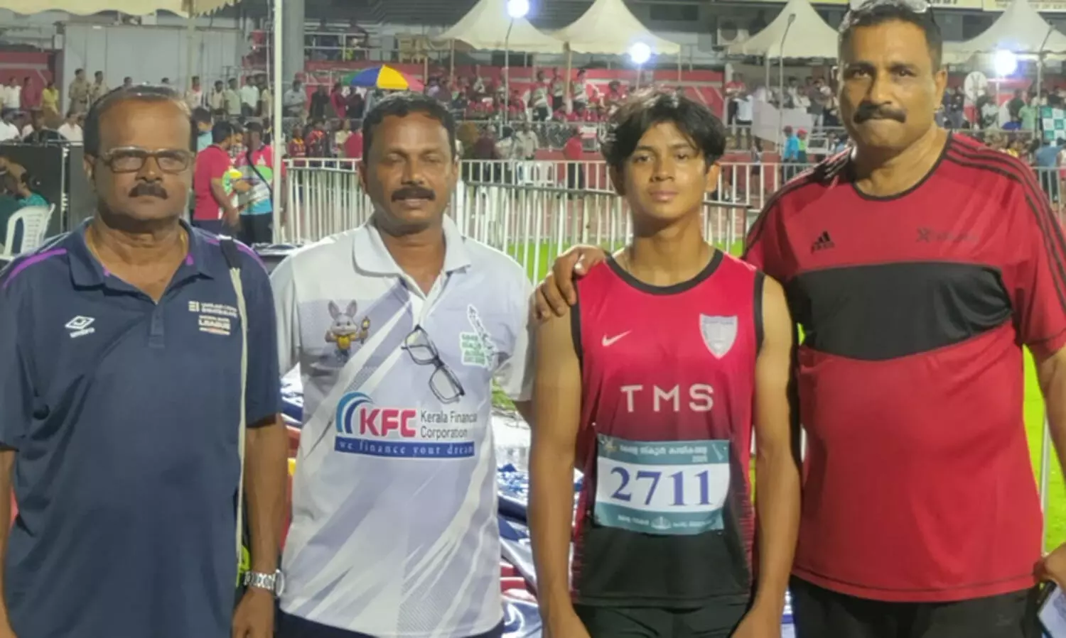 Swanik Joshua, who won a silver medal in the 100m race, with his coaches
