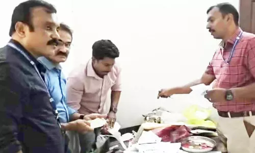 Vigilance raid; Money and liquor bottle found at Karuppur village office